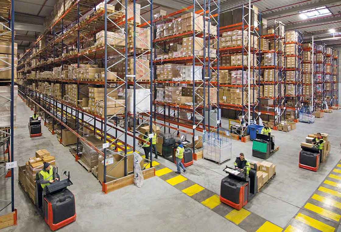 Forklifts moving goods in a warehouse Forklifts moving goods in a warehouse
