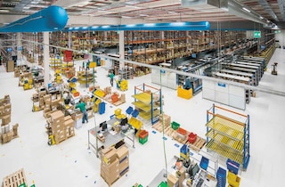 Operators perform product picking and packing tasks in the warehouse