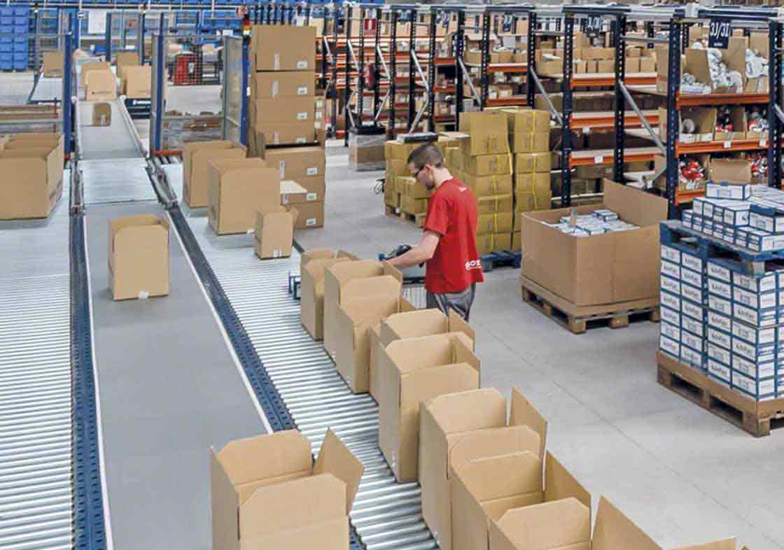 Warehouse employees checking the order fulfillment automation system Warehouse employees checking the order fulfillment automation system