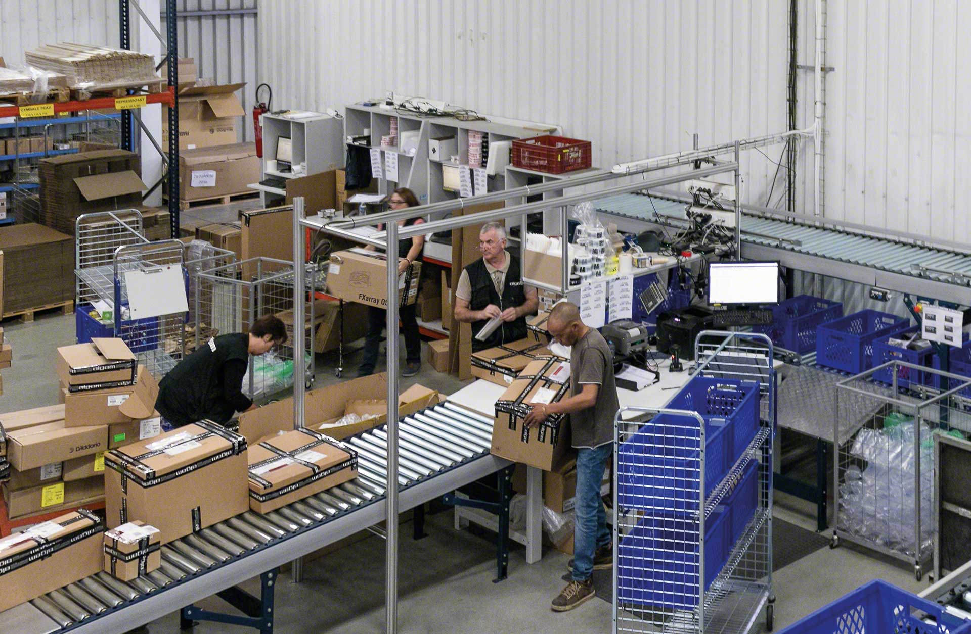 Warehouse workers preparing orders manually Warehouse workers preparing orders manually