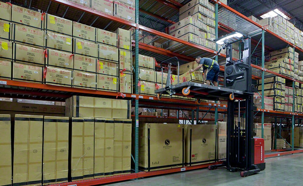 Through the use of a more efficient layout with narrow aisles, workers are able to hand-load furniture into the selective rack quickly