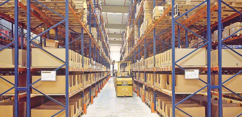 Operator working on a lower level of pallet racking