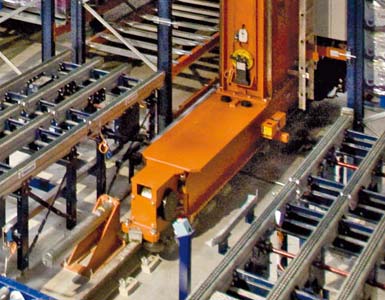 Detail of a lower support or frame for a stacker crane and of a rail
