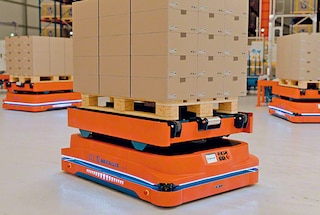 AMR robots transport pallets inside the warehouse