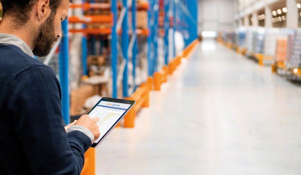 Warehouse associates use inventory management systems for accurate stock control