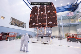 NASA technicians examine the Nancy Grace Roman Space Telescope after connecting its inner and outer sections