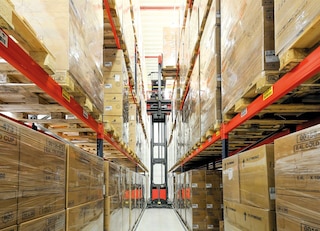 An order picker operates within narrow-aisle pallet racking An order picker operates within narrow-aisle pallet racking