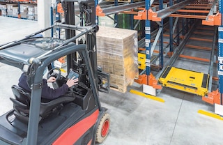 Operators use a forklift to place the pallet at the entrance to each lane