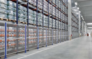 Perimeter safety enclosures are installed on the sides of the racking