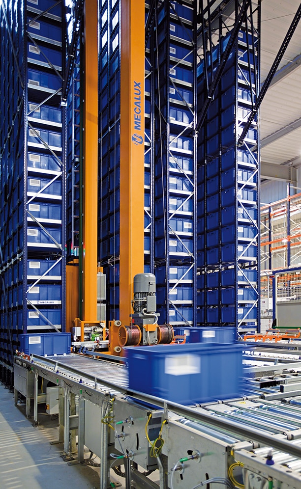 The automated miniload warehouse has two stacker cranes that move along each of the storage aisles
