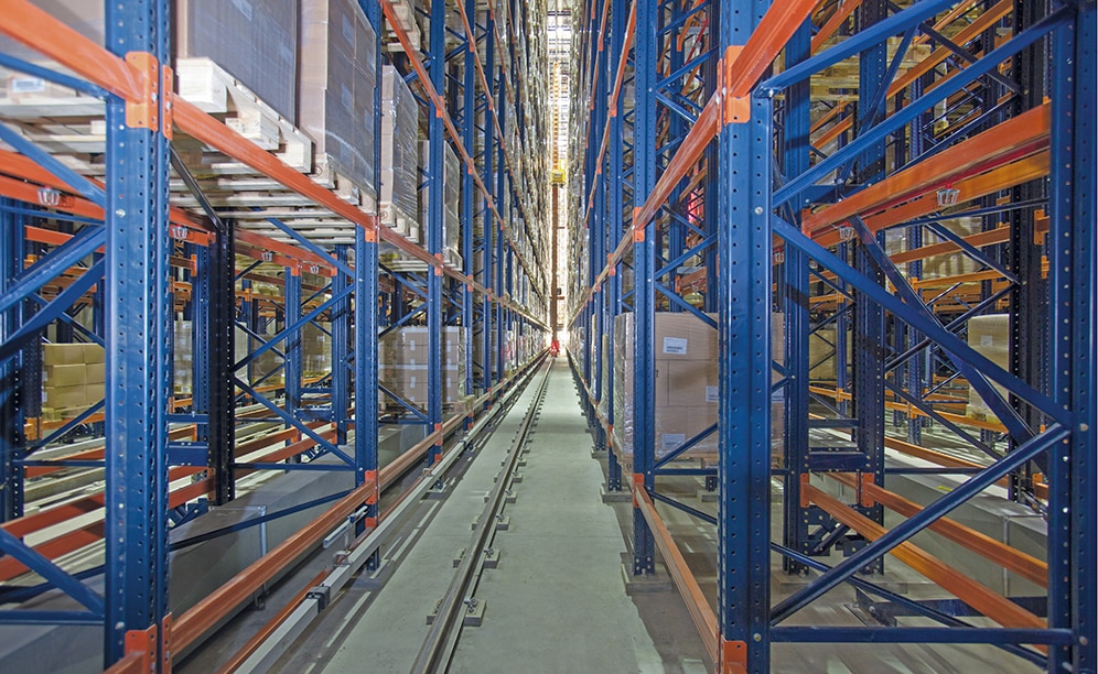 In each aisle, the stacker cranes are responsible for transferring the pallets between input and output conveyors and their corresponding location on the racks